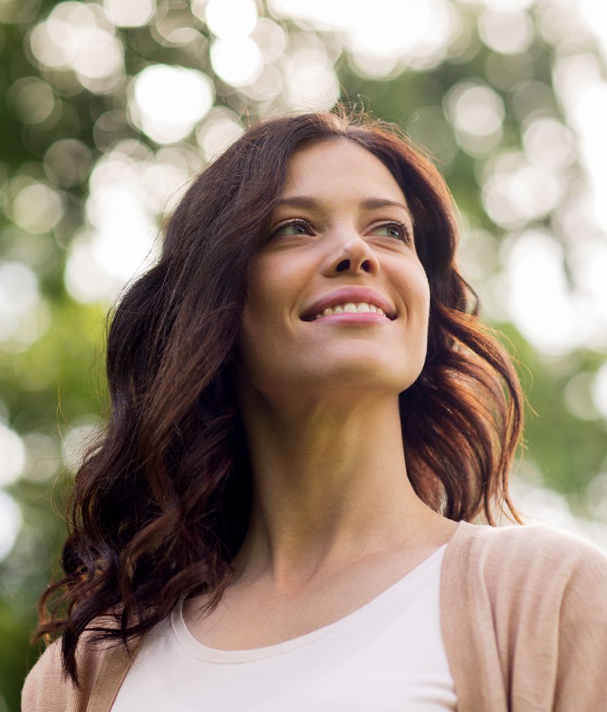 Woman in white shirt and beige top