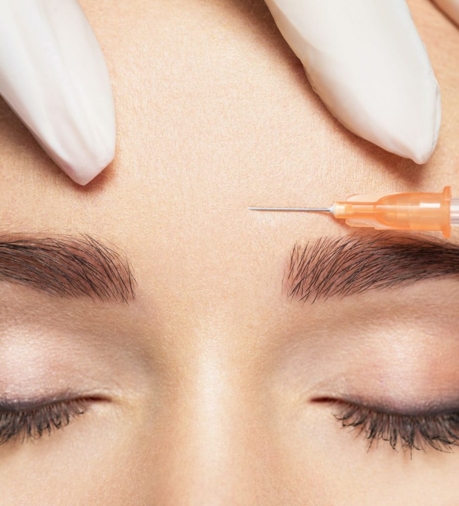 Closeup on a woman getting an injection in her brow