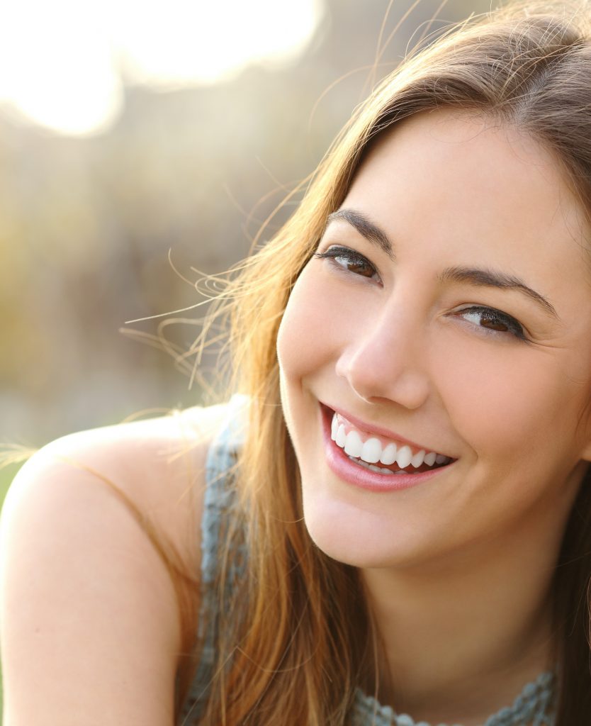 Smiling woman with light brown hair