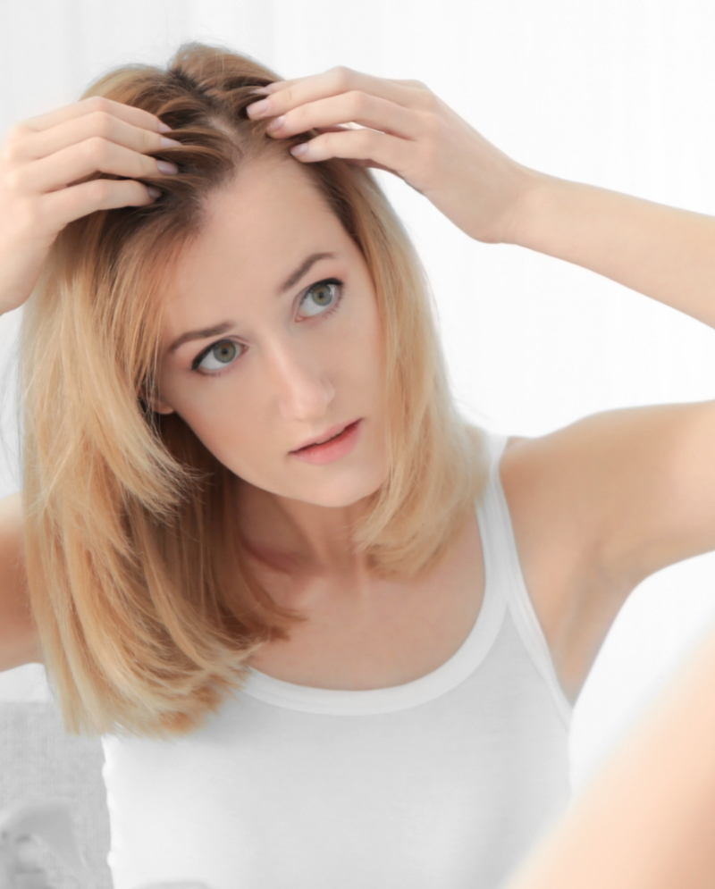 Woman checking for hair loss