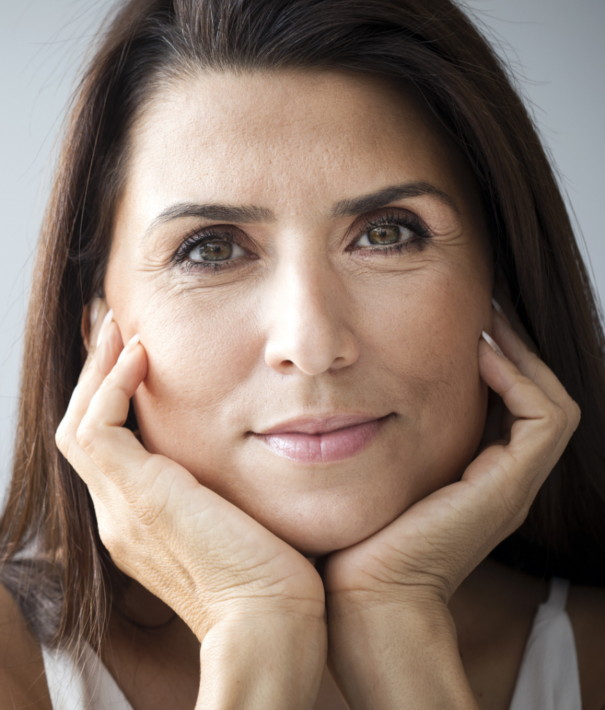 Woman with her chin resting between her hands