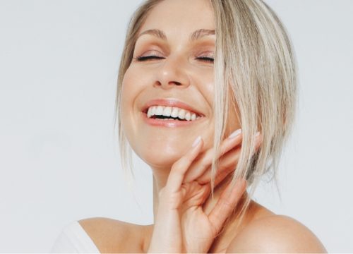 Happy woman after XEO skin therapy